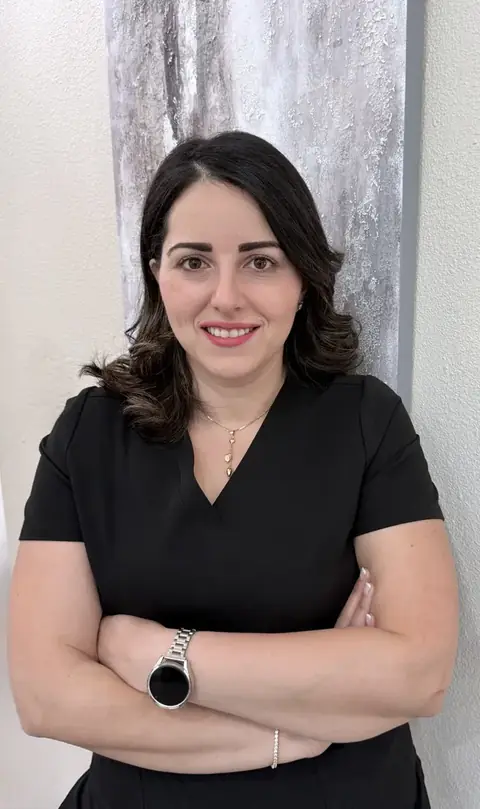 Batool Farahat-Zabaneh wearing a black shirt with her arms crossed